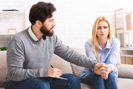 Male Counsellor Performing Dialectical Behavioral Therapy To A Female Patient
