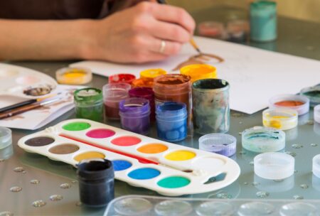artist making gouache painting