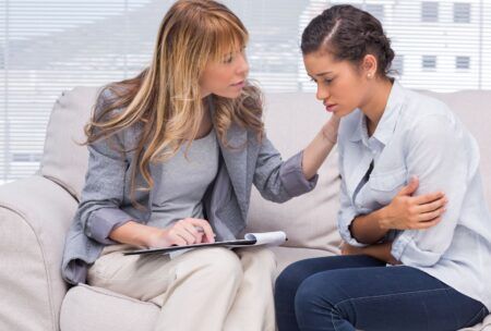 therapist performing solution focused brief therapy on a patient