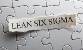 Jigsaw puzzle piece with 'lean six sigma' written on it. Symbolizes the concept of lean six sigma yellow belt