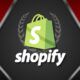 Shopify logo on red and black background, representing Shopify website development