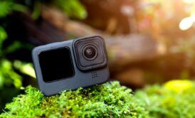 An action camera on a mossy rock - perfect GoPro for beginners