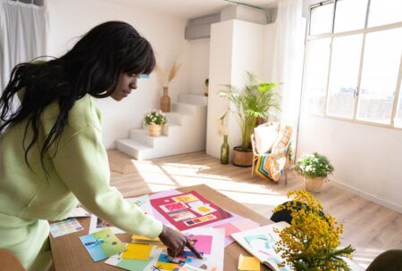 A woman focused on her project in a room, embodying productivity tips for creatives
