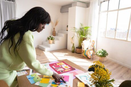 A woman focused on her project in a room, embodying productivity tips for creatives