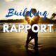 Two people on a beach with a text overlay that reads Building Rapport
