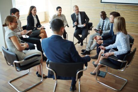business professionals discussing measuring training effectiveness in a meeting room