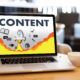visual representation of content creation for websites, showing a laptop with a cup of coffee nearby