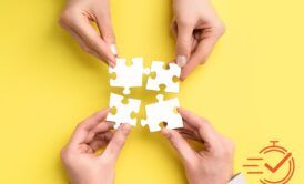 hands holding puzzle pieces on yellow background, symbolizing collaboration skills