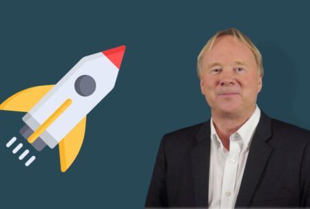 a man in formal attire stands alongside a rocket, illustrating concepts of leadership and management training in a futuristic setting