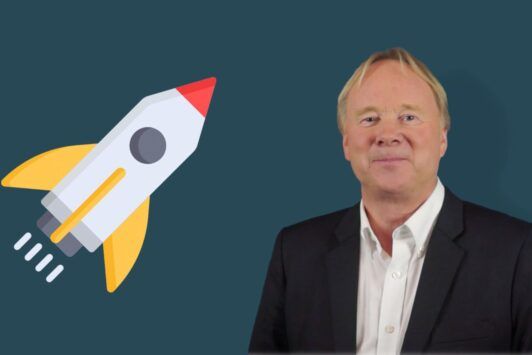 a man in formal attire stands alongside a rocket, illustrating concepts of leadership and management training in a futuristic setting