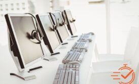 A lineup of computers donning headsets, prepared to manage service requests and provide support.