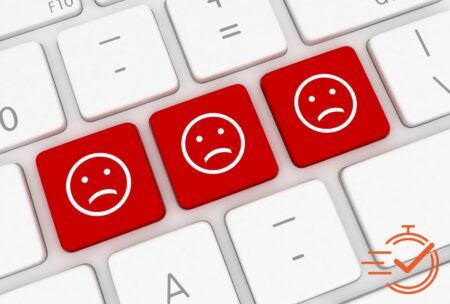 A keyboard with three red smiley faces, symbolizing the challenge of dealing with a difficult customer types