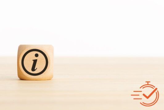 a wooden block on a desk representing a guide on keep your customers informed of your products and services