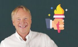 a smiling chris croft with a torch in the background, representing inspirational leadership and the illumination of hope and guidance for others