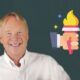 a smiling chris croft with a torch in the background, representing inspirational leadership and the illumination of hope and guidance for others