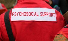 Individual wearing a red jacket with 