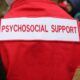 Individual wearing a red jacket with 