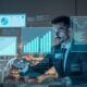A man analyzes graphs on a laptop, focusing on methods to simplify accounting for small businesses.