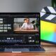 A laptop running Final Cut Pro X video editor, highlighting the editing timeline and tool options for video production.