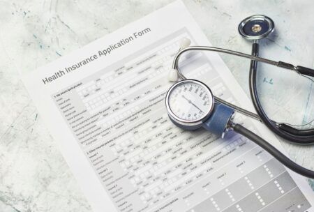 a health insurance application form illustrating the importance of health coverage in medical care
