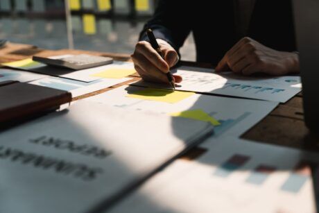 Businessman engaged in creating a business plan, with a focus on achieving product owner certification scrum exam for career advancement.