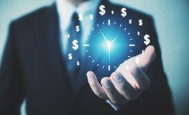 businessman holding a clock adorned with dollar signs, symbolizing time management hacks for financial success