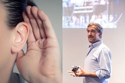 a man speaks to a woman while she listens intently, demonstrating consultative selling techniques