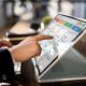 an individual uses a touch screen laptop to explore an introduction to agile concepts