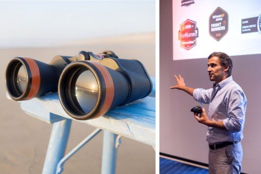 a man presents on lead generation course, accompanied by an image of binoculars, symbolizing focus and insight in marketing