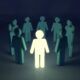 a person stands confidently in a circle of people, embodying an innovative mindset and fostering collaboration